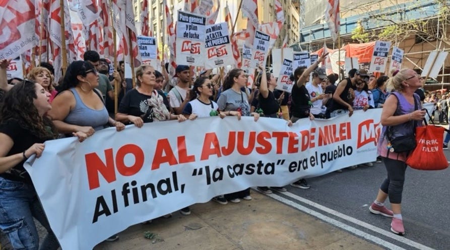 A group of people holding signs

AI-generated content may be incorrect.
