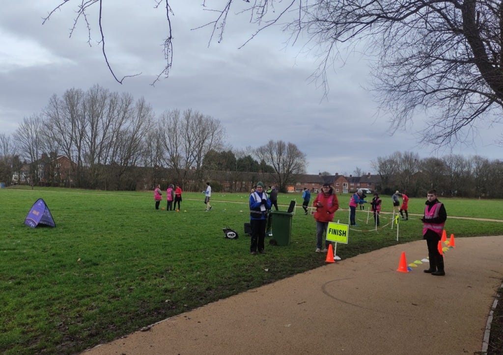 Cones and tape mark the finish on the path, leading finishers off onto the grass