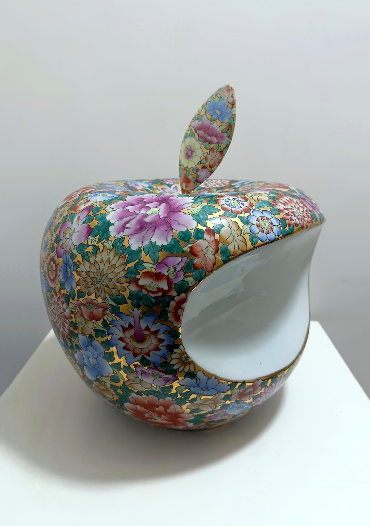 A colorful apple shaped object with a flower pattern

AI-generated content may be incorrect.
