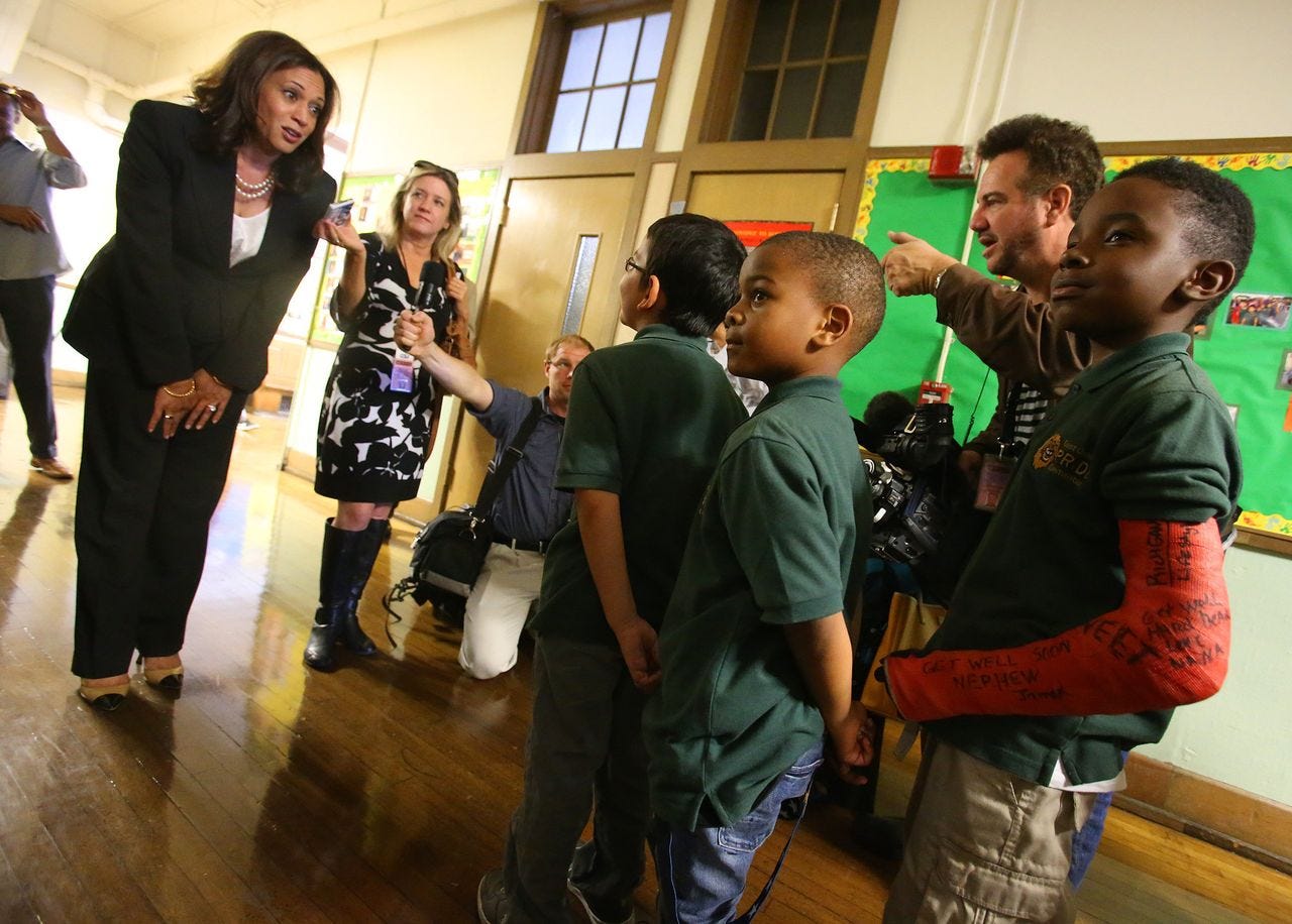 Harris, who was the attorney general for California at the time, talks with students at the East Oakland Pride Elementary School in Oakland on Sept. 4, 2014. She sponsored legislation to help local school districts and communities address California's elementary school truancy crisis. Harris, who was the attorney general for California at the time, talks with students at the East Oakland Pride Elementary School in Oakland on Sept. 4, 2014. She sponsored legislation to help local school districts and communities address California's elementary school truancy crisis.