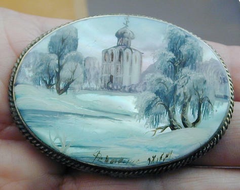 Antique mother of pearl handpainted Russian brooches.