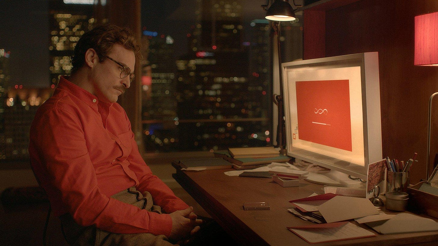 Still from the 2013 film Her showing the main character Theodore (played by Joaquin Phoenix) gazing longingly at his orange computer screen in his home that display an orange screen with the fictional artificially intelligent operating system (voiced by Scarlett Johansson) Still from the 2013 film Her showing the main character Theodore (played by Joaquin Phoenix) gazing longingly at his orange computer screen in his home that display an orange screen with the fictional artificially intelligent operating system (voiced by Scarlett Johansson)