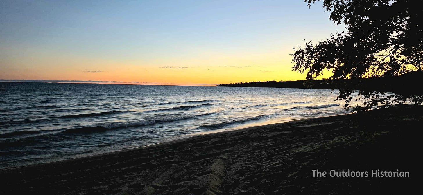 A blue sky that fades to a golden glow over a point in the distance.