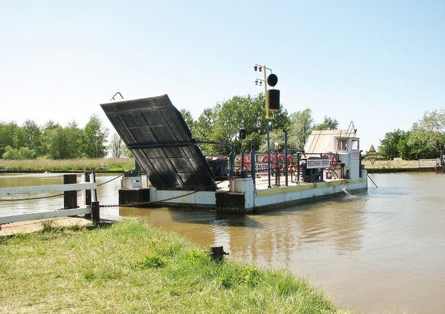 a ferry crossing a river