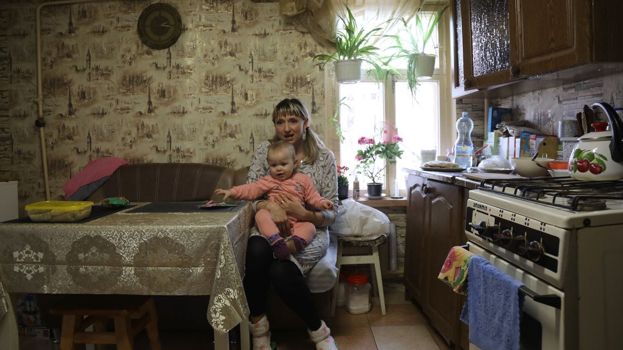 Tetiana Pavelko sits at her kitchen table with Kira on her lap. "She is the meaning of my life ... I can't imagine my life without Kira," she says. Tetiana Pavelko sits at her kitchen table with Kira on her lap. "She is the meaning of my life ... I can't imagine my life without Kira," she says.