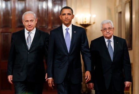 three men in suits walk in a corridor three men in suits walk in a corridor