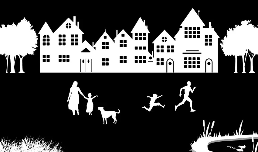 Silhouette style image of a family playing together in an urban park. 