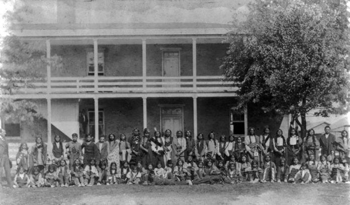 A group of people posing for a photo

Description automatically generated