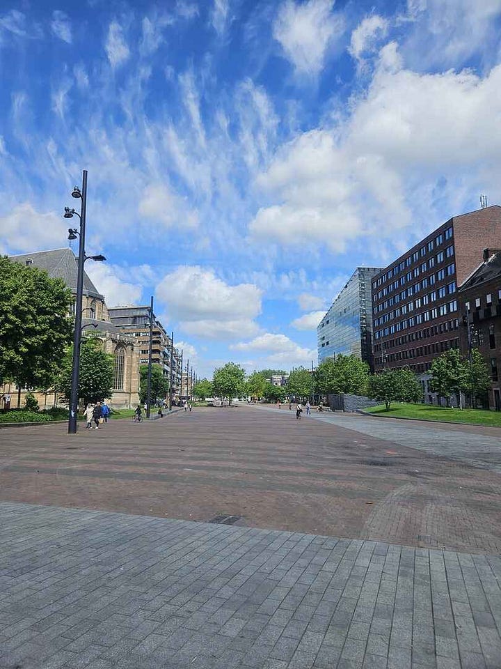 Rotterdam central squares with paving stone walking areas and several modern art sculptures