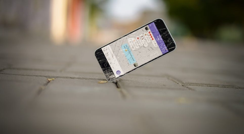 selective focus photo of iPhone balance on brick pavement selective focus photo of iPhone balance on brick pavement