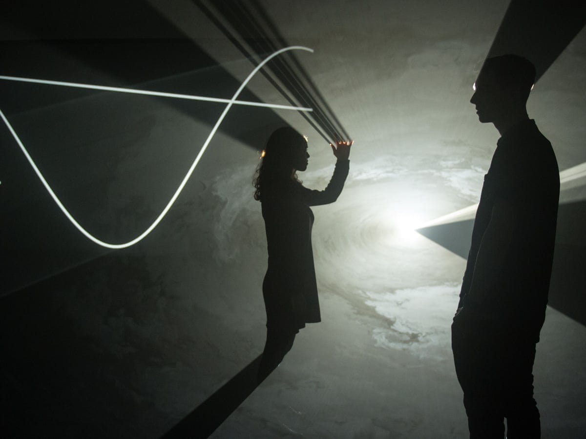 A glowing cosmic spectacle – Anthony McCall Solid Light Works review | Art  | The Guardian
