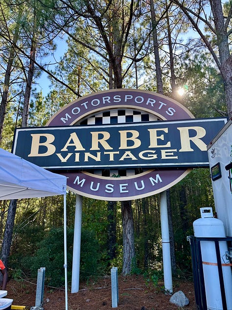 Barber Vintage Motorsports Museum Sign; vintage motorcycles on display; Jessica with her hair in two braids in one of the areas of the bike museum;dozens of bikes stacked on a very tall display; King Kenny Roberts wearing a cowboy hat and sitting on a yellow bike