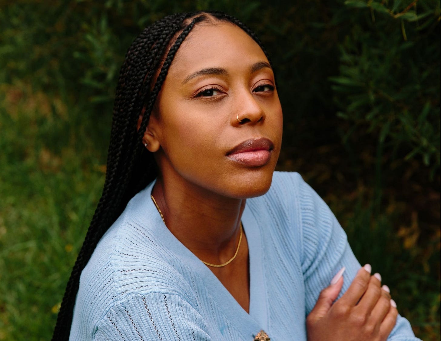 shanetta mcdonald black woman long braids nose ring staring at camera shanetta mcdonald black woman long braids nose ring staring at camera