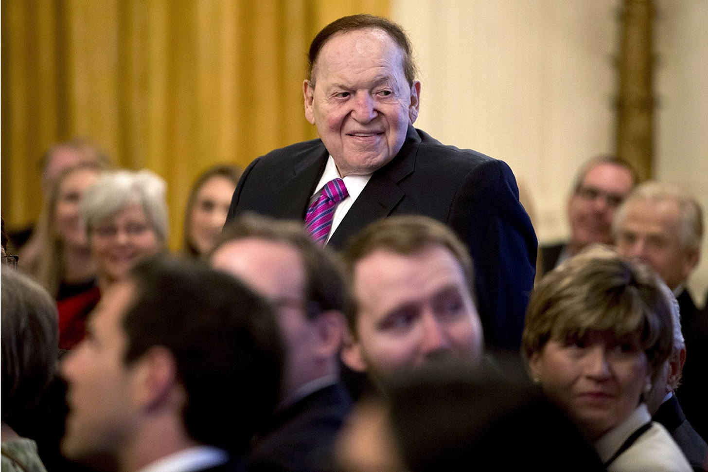 Casino magnate and Republican mega donor Sheldon Adelson is recognized by President Donald Trump during a Nov. 16, 2018 Medal of Freedom ceremony in the East Room of the White House. | Andrew Harnik/AP Photo