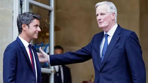 STEPHANE DE SAKUTIN/AFP Newly appointed Prime minister Michel Barnier (R) greets outgoing Prime minister Gabriel Attal (L) as they attend the handover ceremony at the Hotel Matignon in Paris, on September 5, 2024 STEPHANE DE SAKUTIN/AFP Newly appointed Prime minister Michel Barnier (R) greets outgoing Prime minister Gabriel Attal (L) as they attend the handover ceremony at the Hotel Matignon in Paris, on September 5, 2024