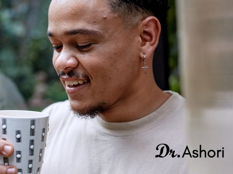 a person holding a cup