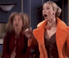 Friends gif. Lisa Kudrow as Phoebe and Jennifer Aniston as Rachel jump up and down, smiling and clapping their hands exuberantly at something offscreen. Friends gif. Lisa Kudrow as Phoebe and Jennifer Aniston as Rachel jump up and down, smiling and clapping their hands exuberantly at something offscreen.