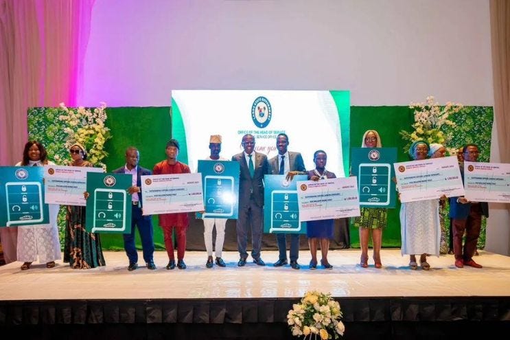 Governor Babajide Sanwo-Olu (M) with the awardees Credit: Lagos State Government