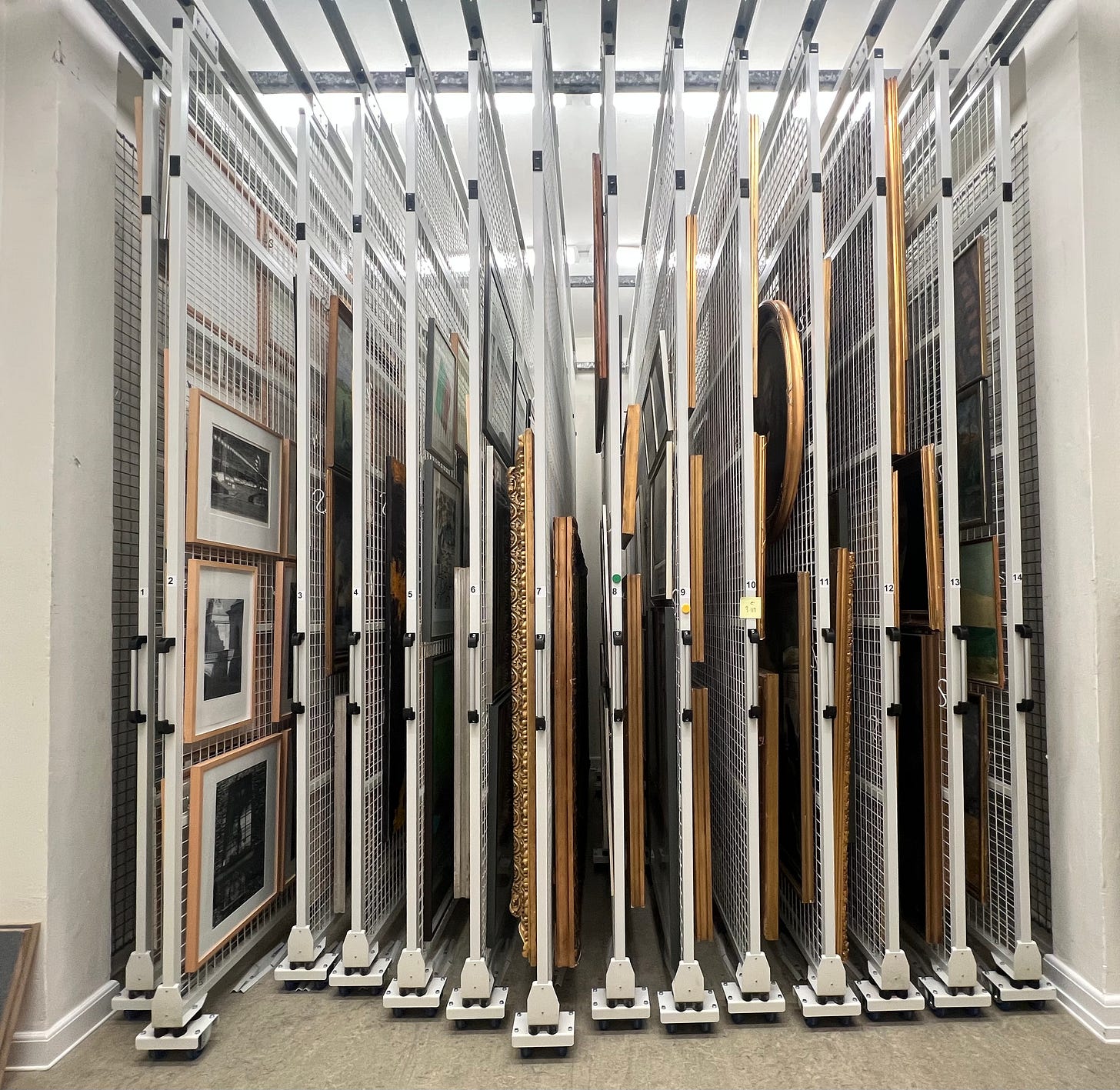 Stacked metal grids of a depot and two paintings from the 1924..