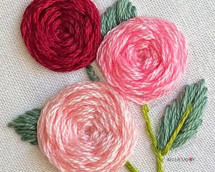 pink, peach, and red woven wheel roses with leaves embroidery design