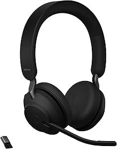 Black Jabra Evolve2 65 professional wireless headset with padded headband, on-ear cushions, and a flexible boom microphone positioned on the left side. A wireless USB dongle is visible to the right of the headset, indicating Bluetooth connectivity. This lightweight business headset features a minimalist design optimized for all-day comfort and clear call quality.