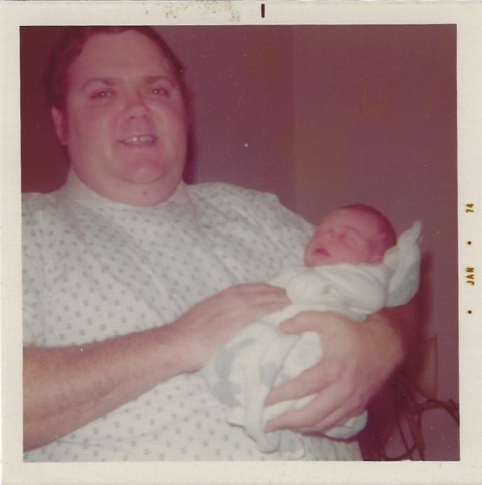 Dad holding me as a newborn January 1974.