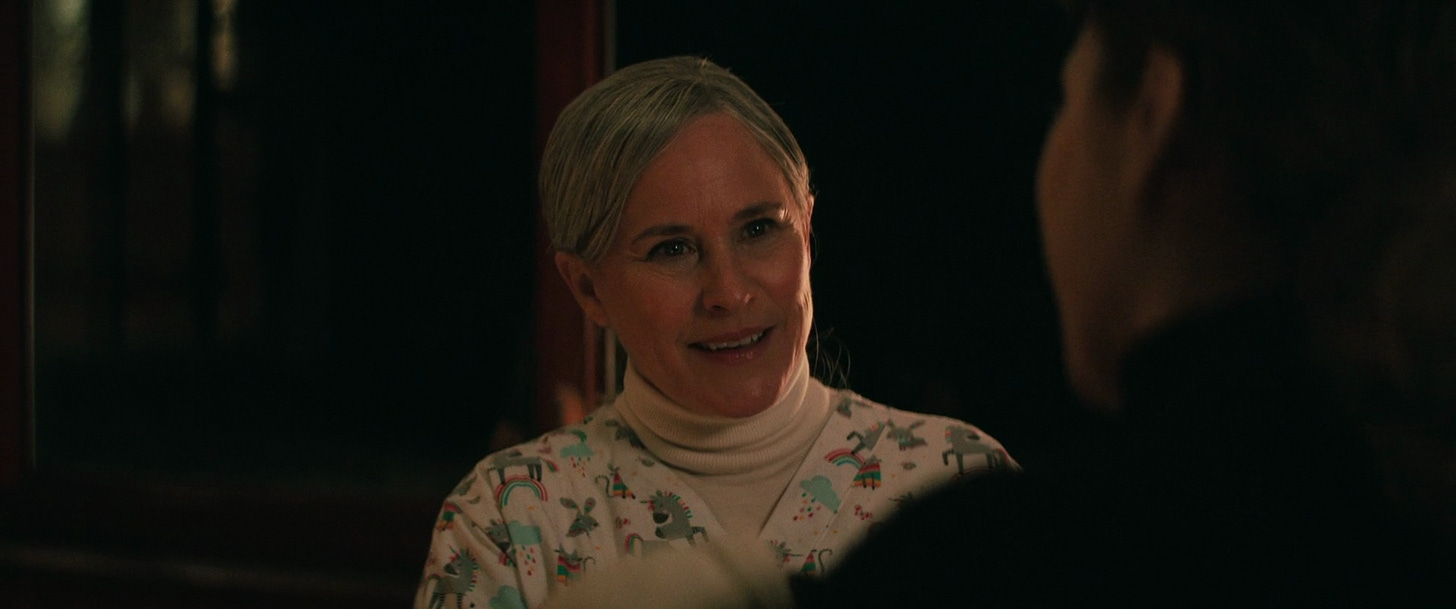 Harmony Cobel (pretending to be a lactation expert for Devon) wearing a colouful PJ set