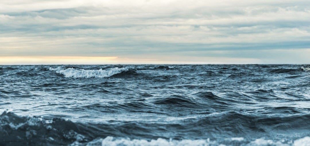 landscape photography of waves and clouds