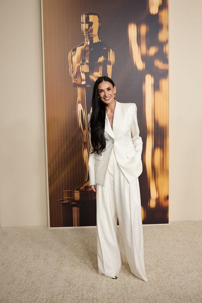 Demi Moore rocks an open back suit for the Academy Awards Nominees ... Demi Moore rocks an open back suit for the Academy Awards Nominees ...
