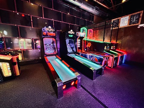 arcade, darts, chairs, tables