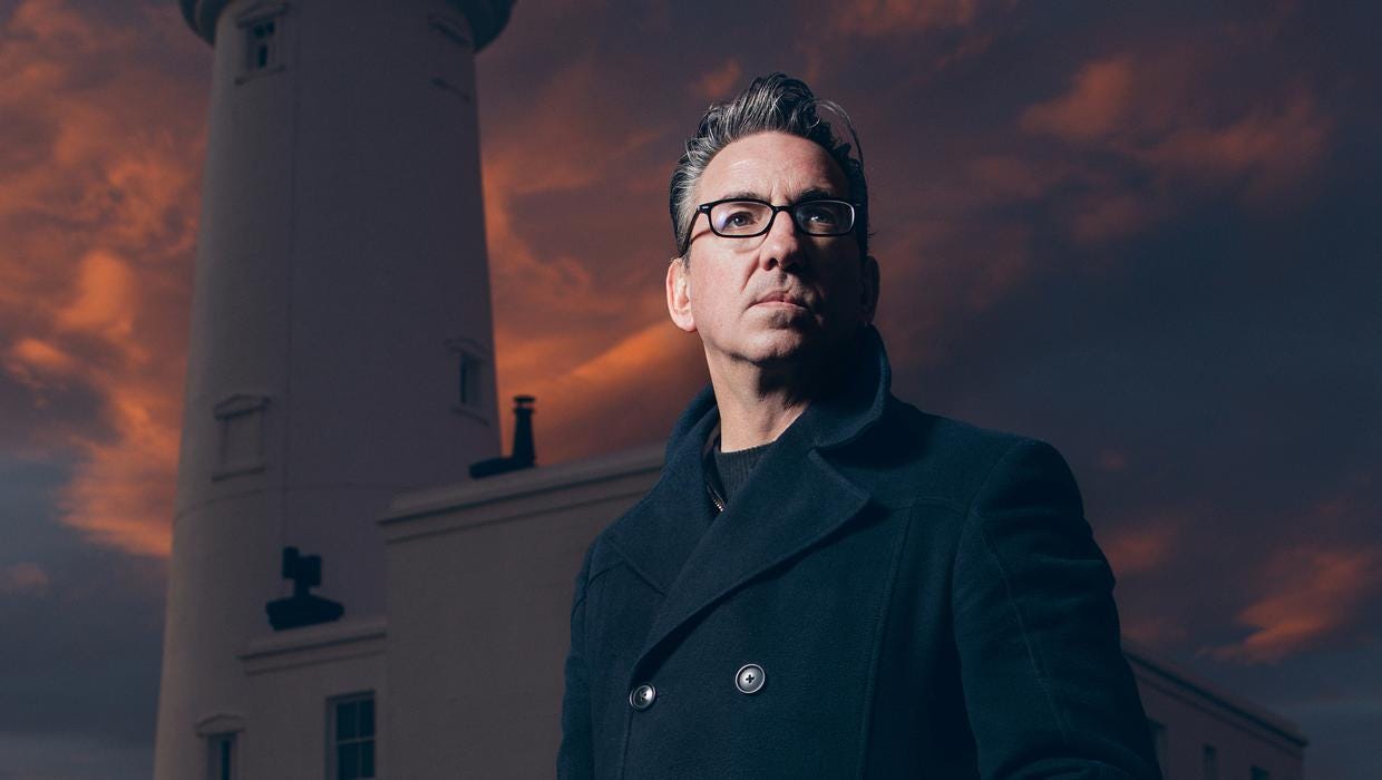 Richard Hawley pictired in front of a lighthouse