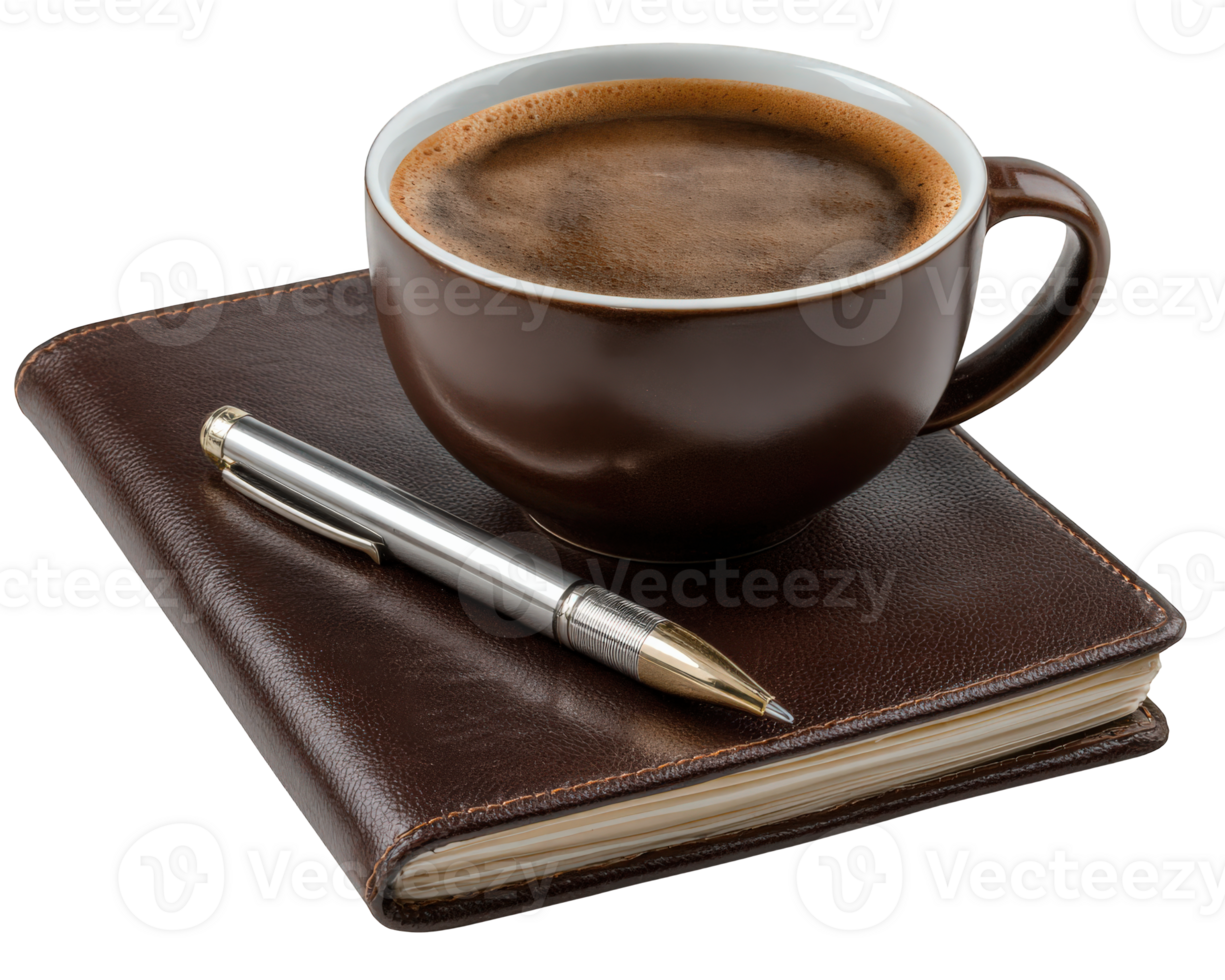 Coffee cup on a leather notebook with a silver pen, symbolizing a creative and relaxed morning moment