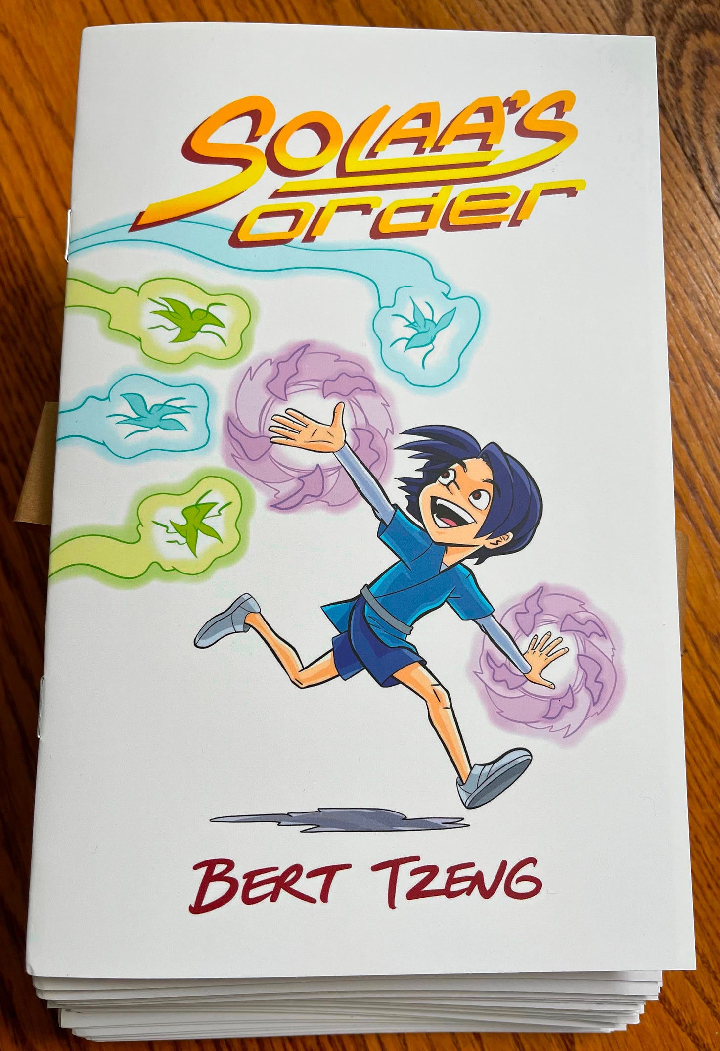 Photo showing a stack of my printed zines.