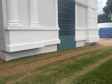 Fake stone columns end several inches above the ground.