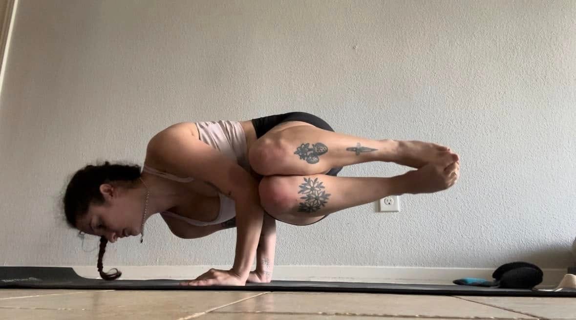 May be an image of 1 person and practicing yoga