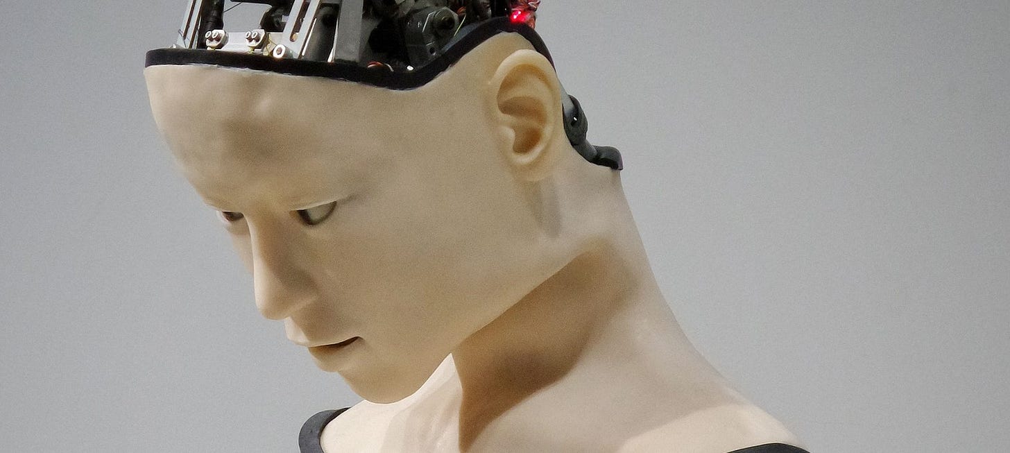 Realistic robot head looking down