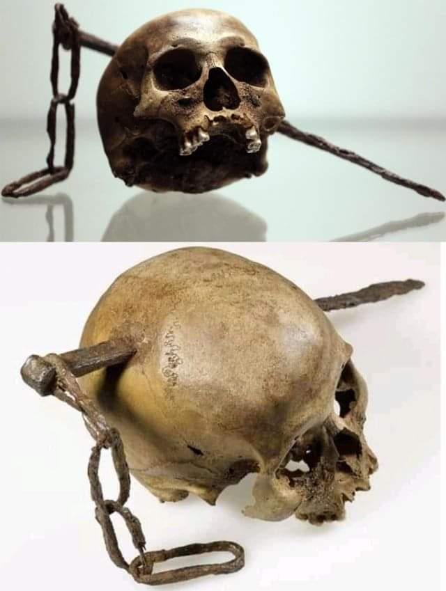 A Roman-era skull with a metal spike driven through it