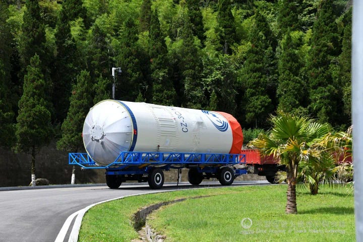 The Long March 3C/E's second-stage arriving at the launch pad and being lifted onto the rocket.