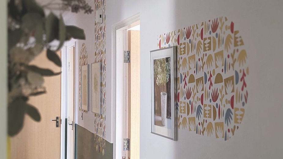 Stencilled colourful mural in hallway