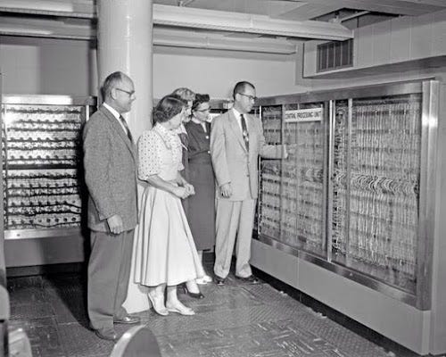 The CPU of an IBM 705 was a massive unit. Photo from Farmers Insurance, showing their first computer.