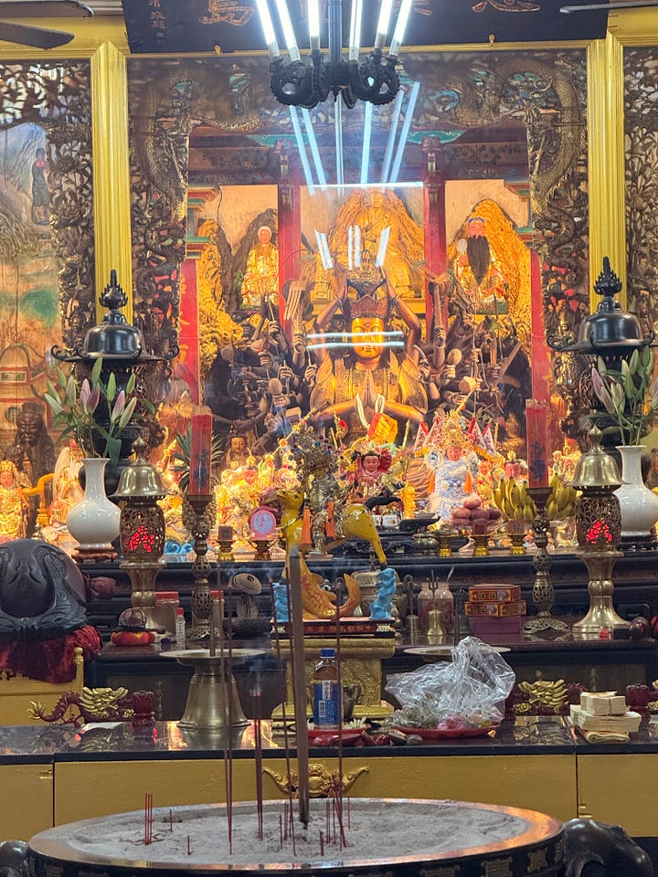 Statues at a Christian and a Folk Altar in Taiwan