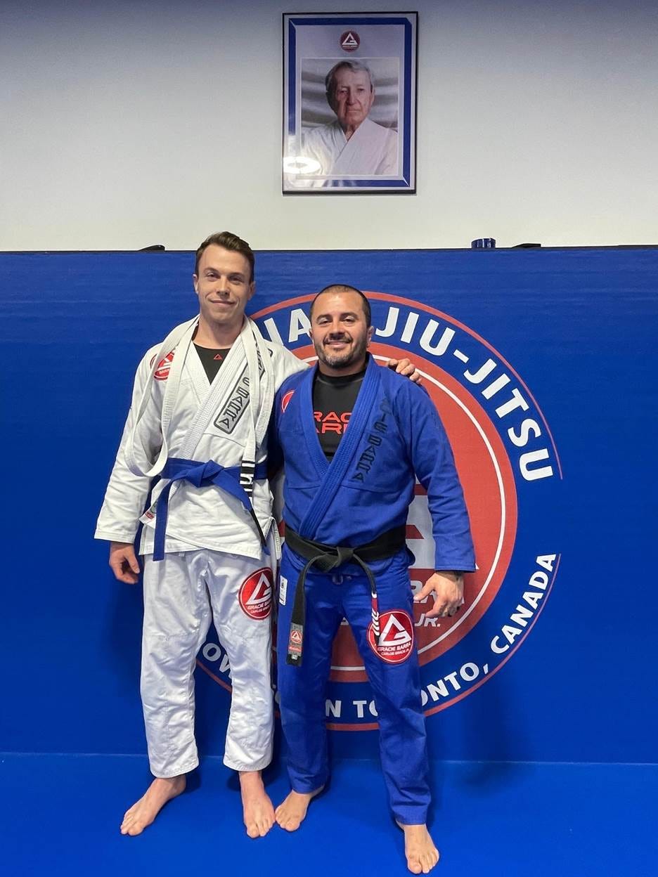 Two men standing in front of a blue wall
AI-generated content may be incorrect. Two men standing in front of a blue wall
AI-generated content may be incorrect.