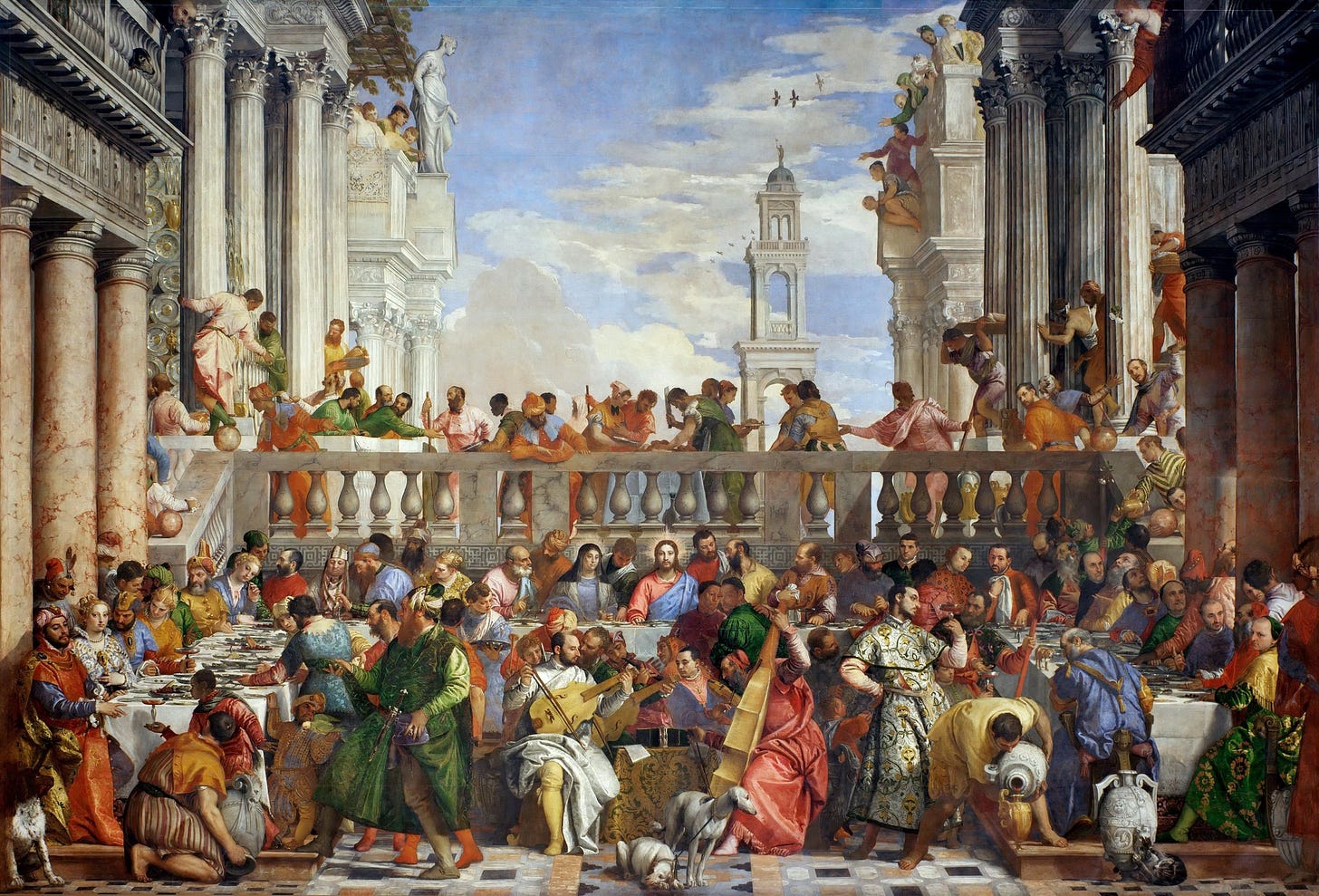 Veronese's Wedding at Cana, a vast banquet scene with 130 figures seated at a long white table under classical columns and a blue sky, musicians playing in the foreground Veronese's Wedding at Cana, a vast banquet scene with 130 figures seated at a long white table under classical columns and a blue sky, musicians playing in the foreground