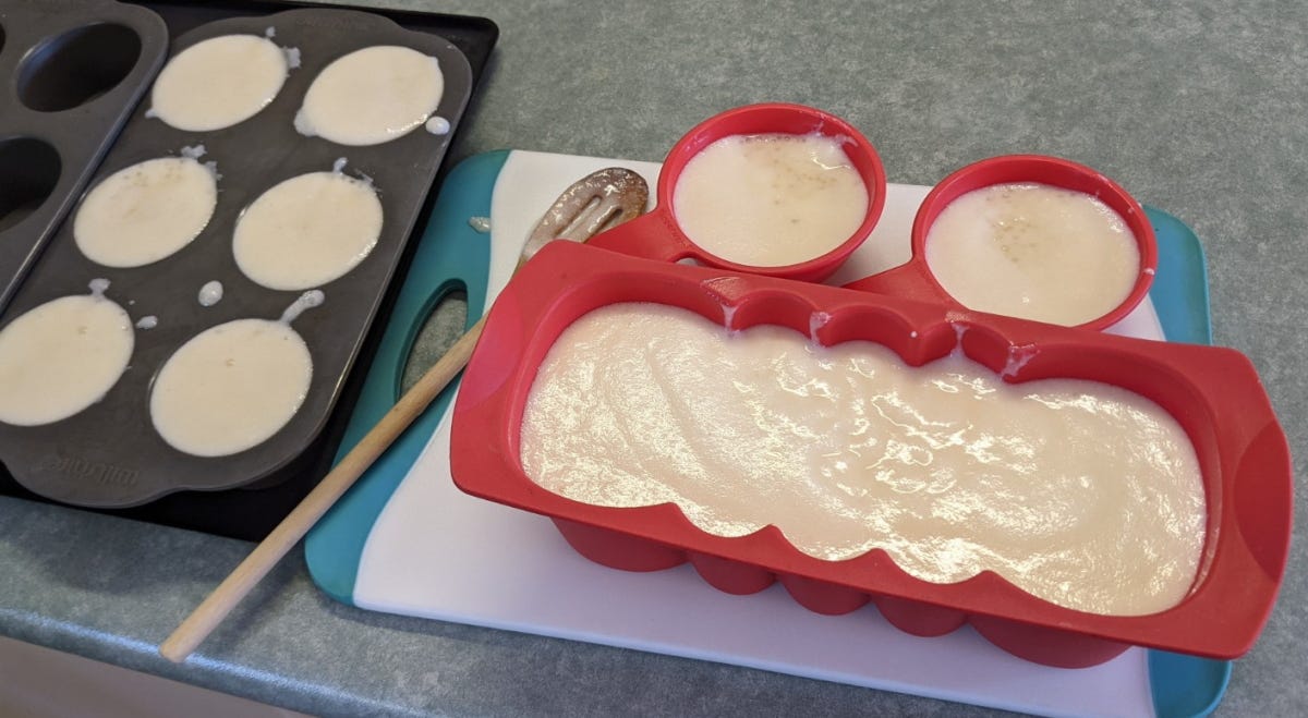 8 small moulds and 1 loaf tin, all filled to the brim.