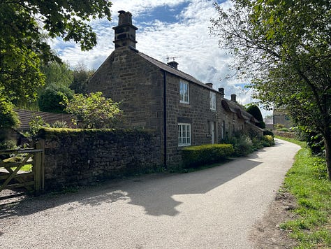 3 Photos. An old stone bridge with the Bar Brook passing underneath and a view of the cottages along the brook. Images: Roland's Travels