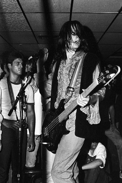 Gallery of 9 images of band Redd Kross, a rockband playing live in a small club called Cathay de Grande in Los Angeles.