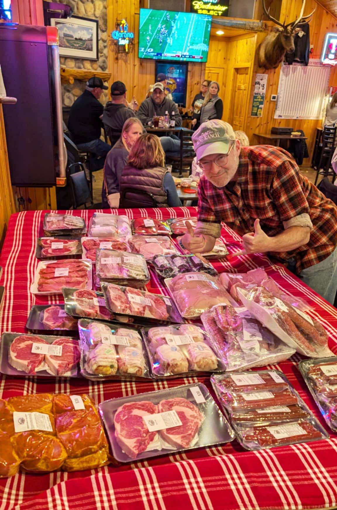 An array of meat on a pool table. 