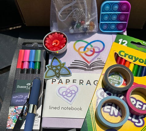 journal and supplies in cardboard box