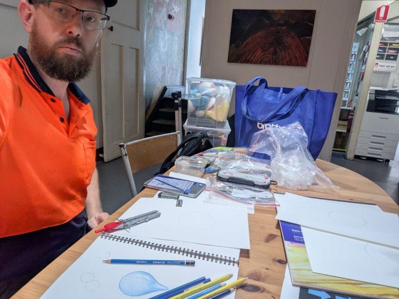 Artists are good at making art but not necessarily at marketing or opportunity hunting. Photo of Michal Plis making art at Melbourne Studio of Art.