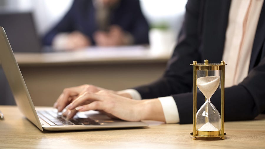 Working with Laptop and Hourglass | AllAboutLean.com